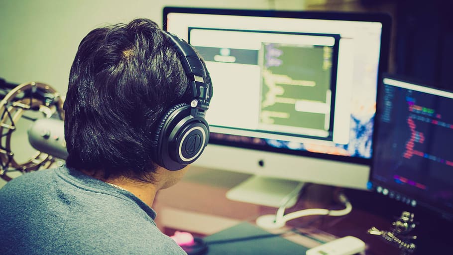 man wearing black headphones in front of computer, programming HD wallpaper