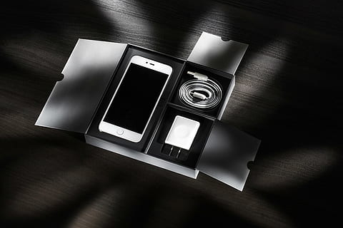 white smartphone with charger inside of box on floor, cellphone HD wallpaper