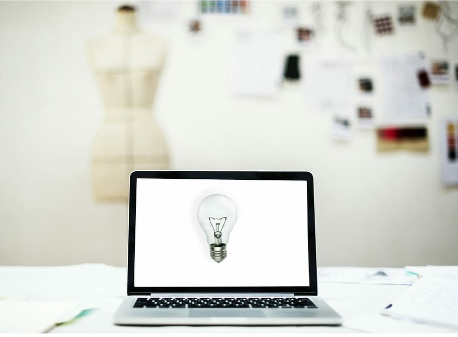 turned-on laptop with light bulb on screen, idea, creative HD wallpaper