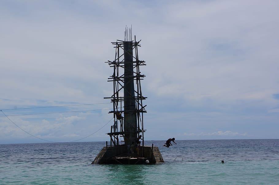 tower, ocean, sea, jumping, beach, sky, water, cloud - sky HD wallpaper