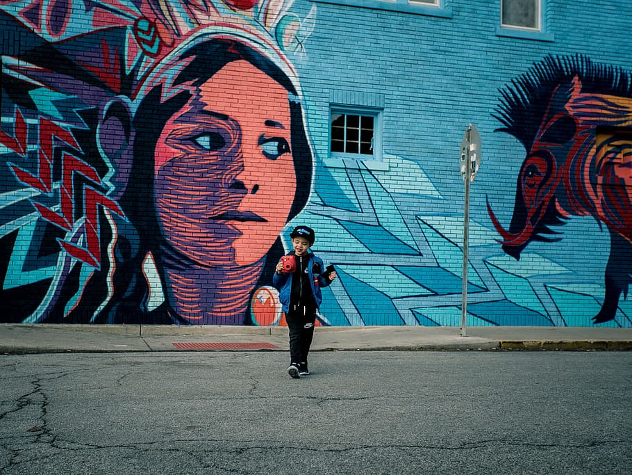 boy standing near vandalism art during daytime, boy standing near wall artwork, HD wallpaper