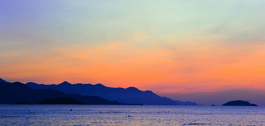 Silhouette of Mountain Beside Ocean during Orange Sunset, beach HD wallpaper