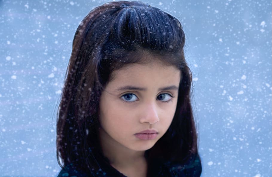 girl outside during snow storm photography, black-haired, portrait