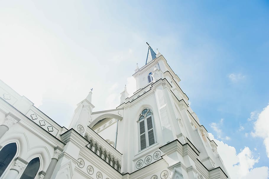 white concrete building under blue sky, low angle photography of castle HD wallpaper