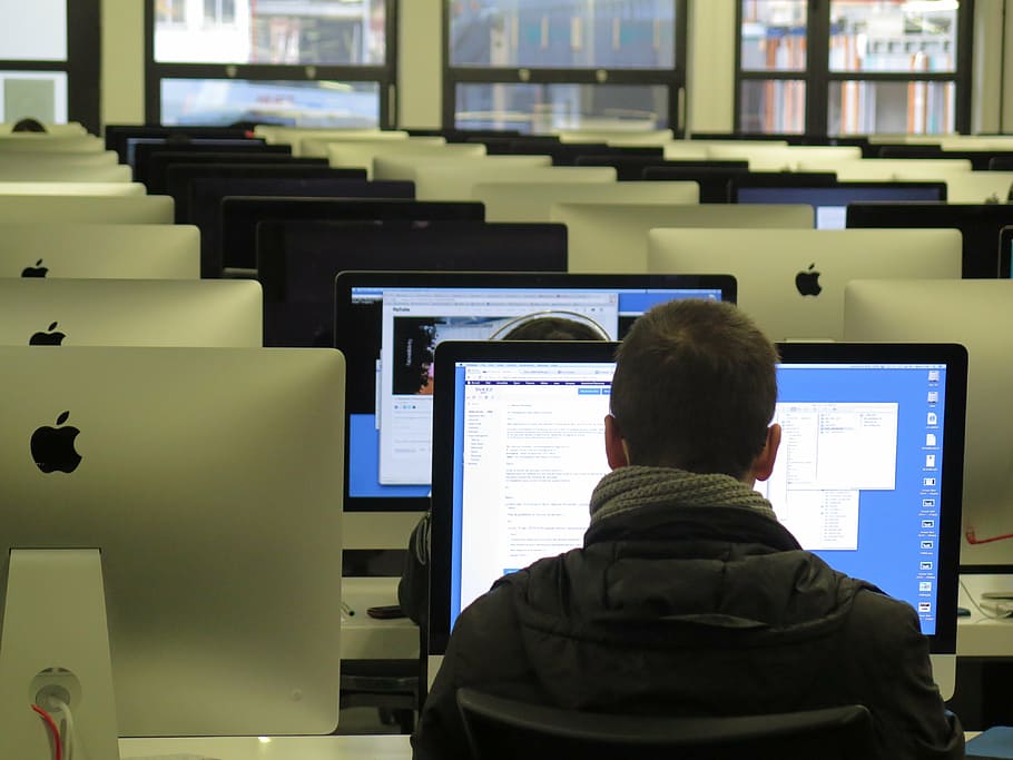 man wearing black top in front of silver iMac, work, school HD wallpaper