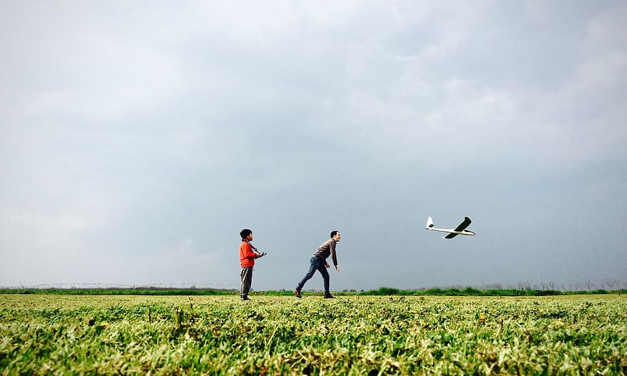 people, playing, men, green, grass, horizon, blue, sky, toy HD wallpaper