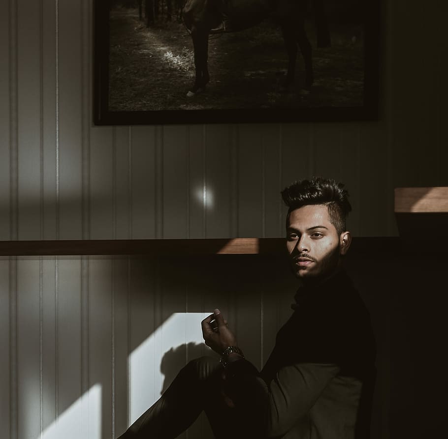 man sitting beside painting, man wearing brown dress shirt, male HD wallpaper