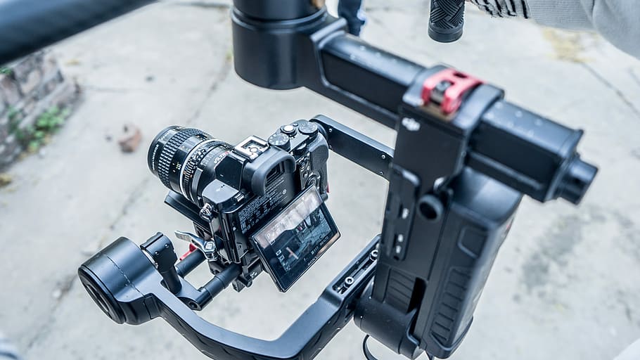 black DSLR camera with black holder, black DSLR camera with stabilizer HD wallpaper