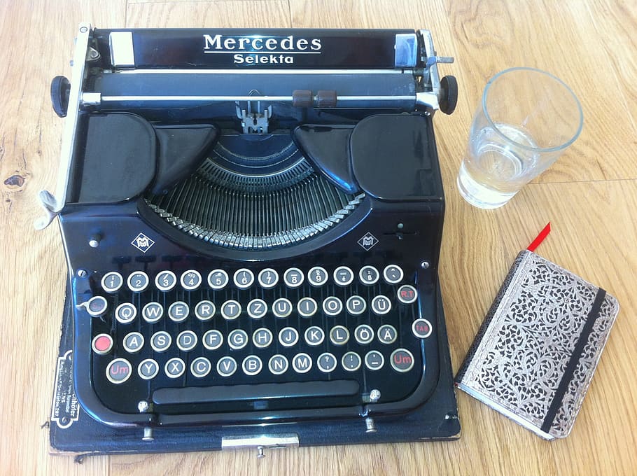 blue and black Mercedes typewriter on brown wooden table, desk HD wallpaper
