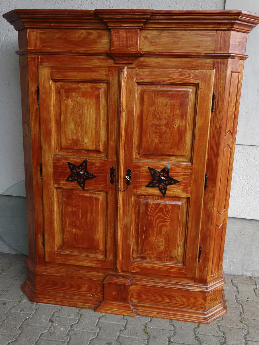 closed brown wooden 2-door cabinet, wall cabinet, wardrobe, red