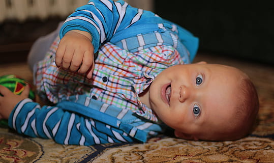 boy in blue jacket lying on the carpet, son, russia, kid, smile HD wallpaper