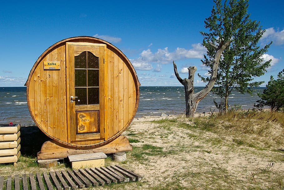 round brown wooden shed near body of water, Baltic, Latvia, Cape Kolka