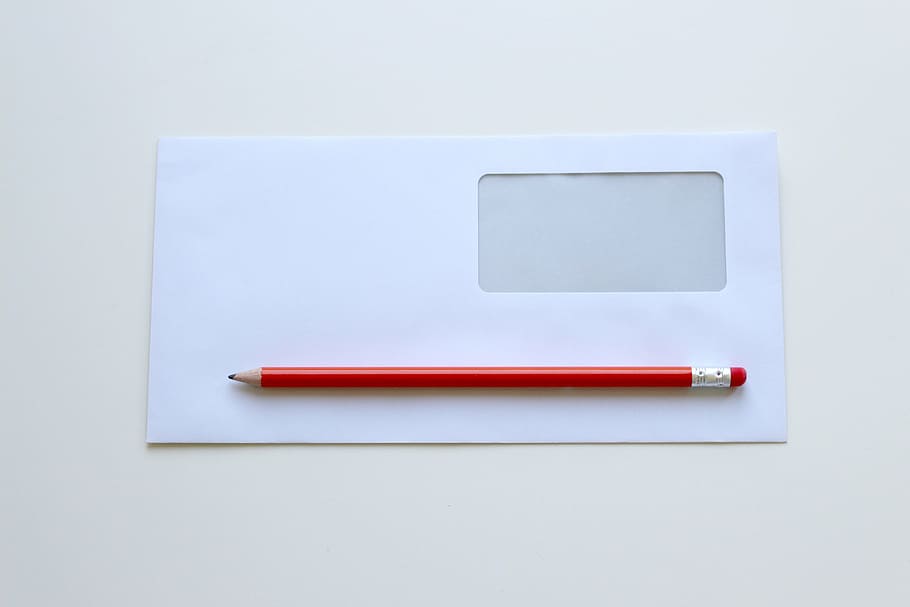 red pencil on white window envelope, office, office desk, pencils