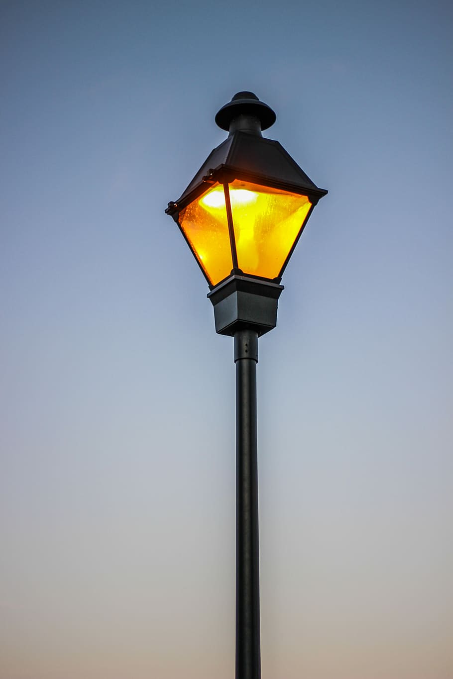 architectural photography of street lamp, black outdoor post light over blue sky HD wallpaper