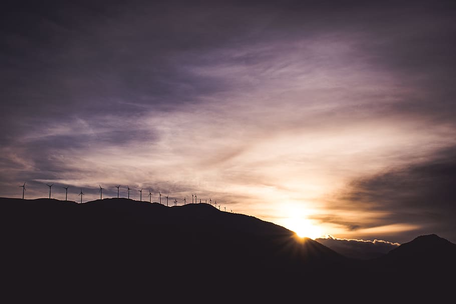 silhouette of mountain during daytime, silhouette of mountain under purple and yellow skies HD wallpaper
