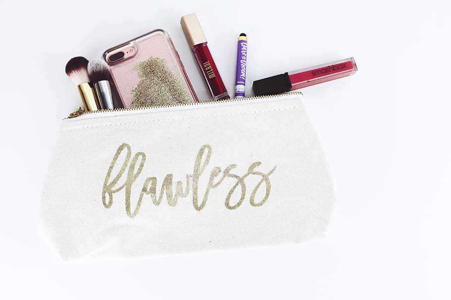 flawless pouch with cosmetics, makeup product in pouch, purse