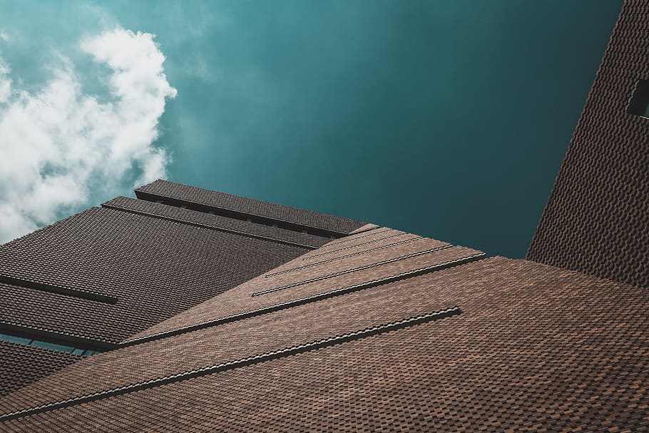 worms eye view of brown concrete building during day time, low angle photo of brown building HD wallpaper