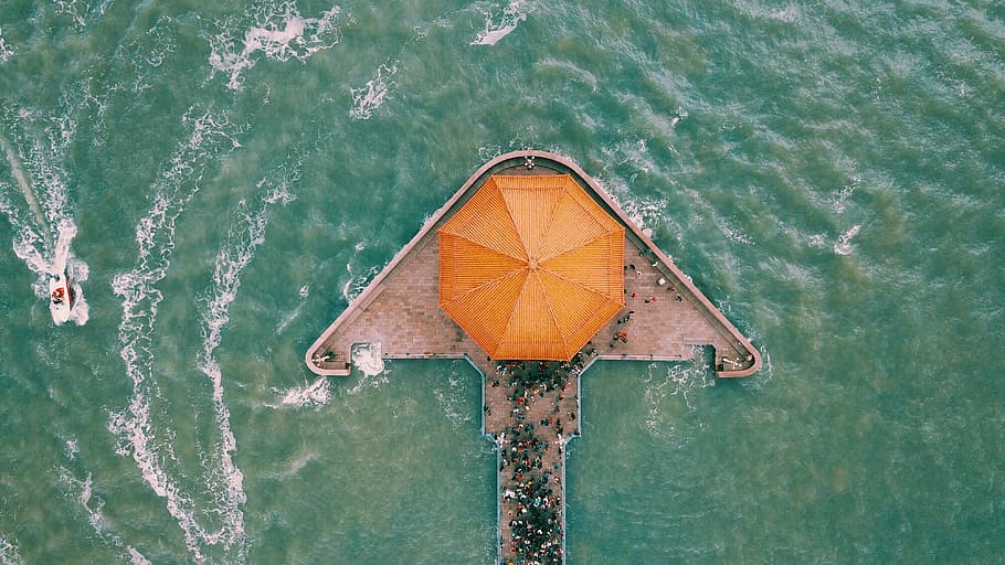 aerial photography of gray and orange building in the middle of sea, aerial view of gazebo HD wallpaper