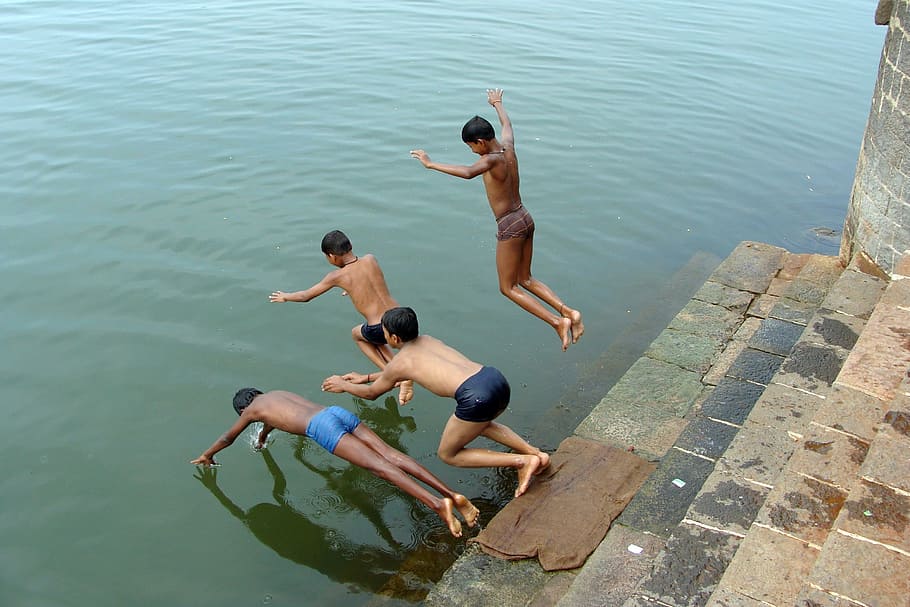 boys diving in water during daytime, children, river, krishna HD wallpaper