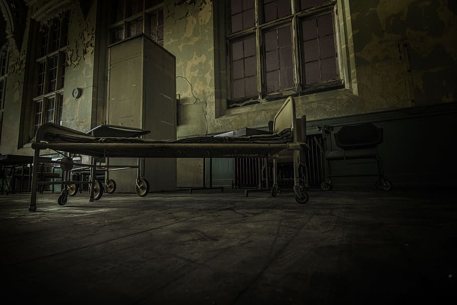 hospital bed on concrete pavement, photo of brown high rise building HD wallpaper