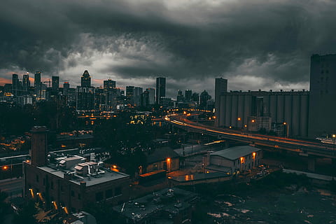 Black Clouds over the Night Time Cityscape of Montreal, Quebec, Canada HD wallpaper