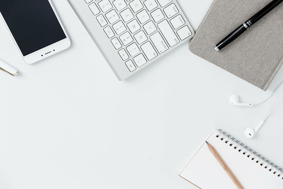 white smartphone beside white wireless keyboard and black pen HD wallpaper