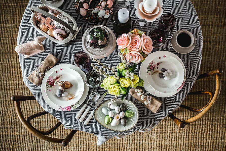 Round dinner table decorated with easter motifs, grey, holidays