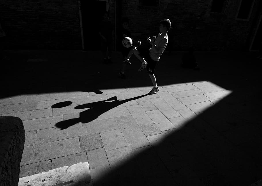 boy playing soccer ball, grayscale photography of boy playing soccer ball HD wallpaper