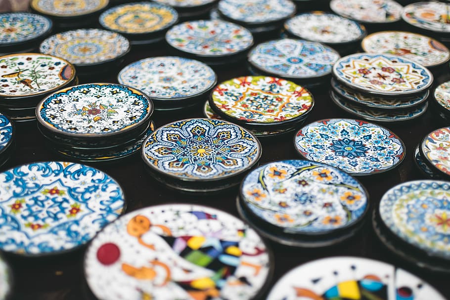 assorted decor lot, tilt shift lens photography of jar lids, plate HD wallpaper