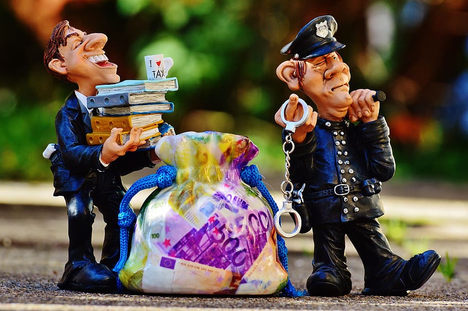 two police man ceramic figures, taxes, tax evasion, handcuffs