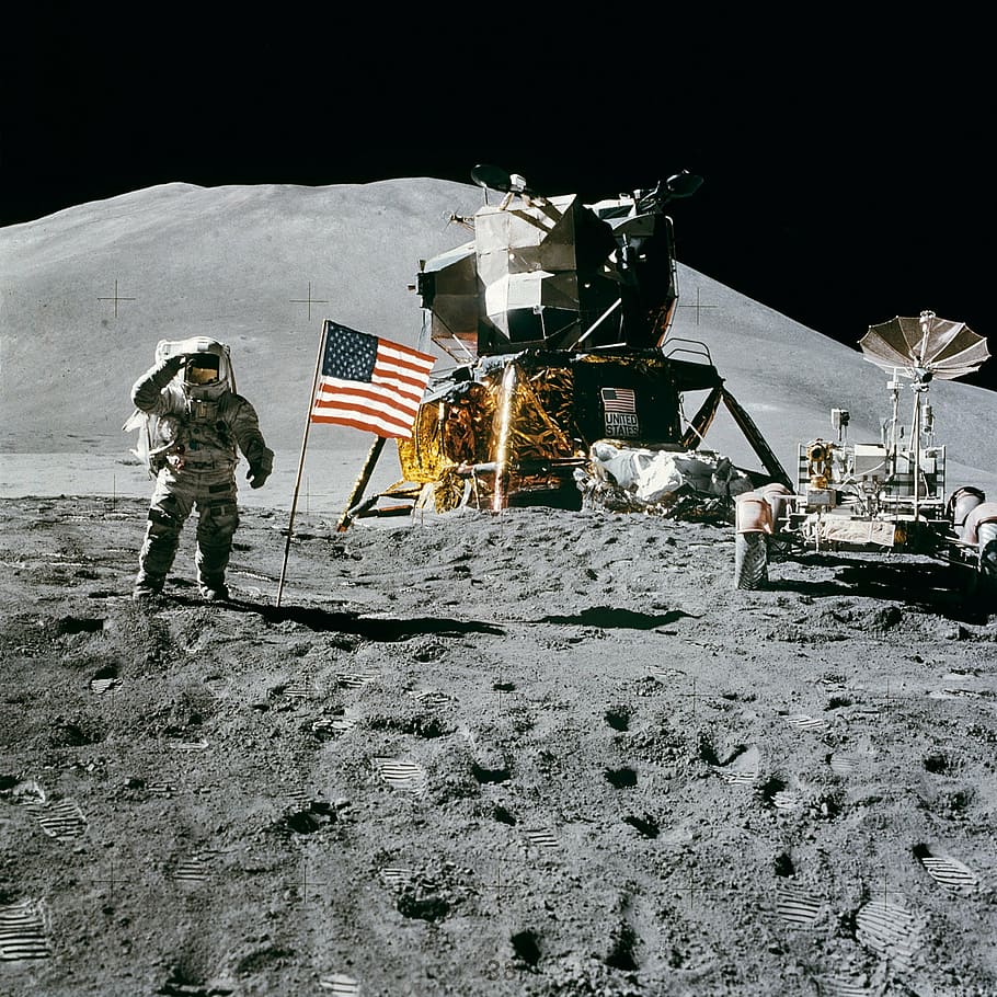 astronaut near American flag and space ship, space station, moon landing
