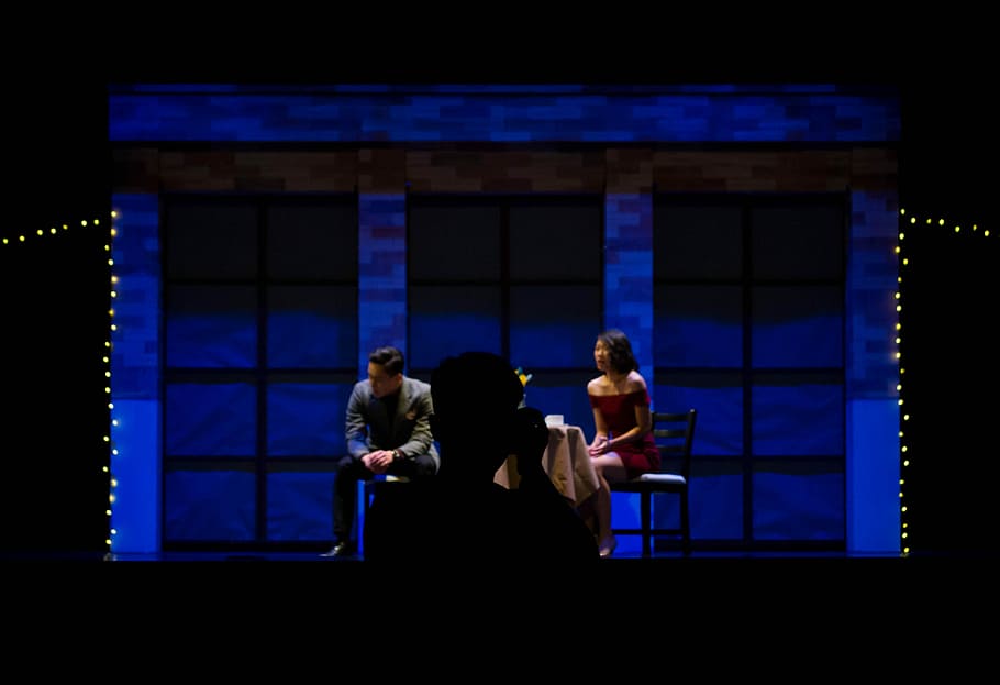 man and woman sitting on chair, woman sitting in black chair HD wallpaper