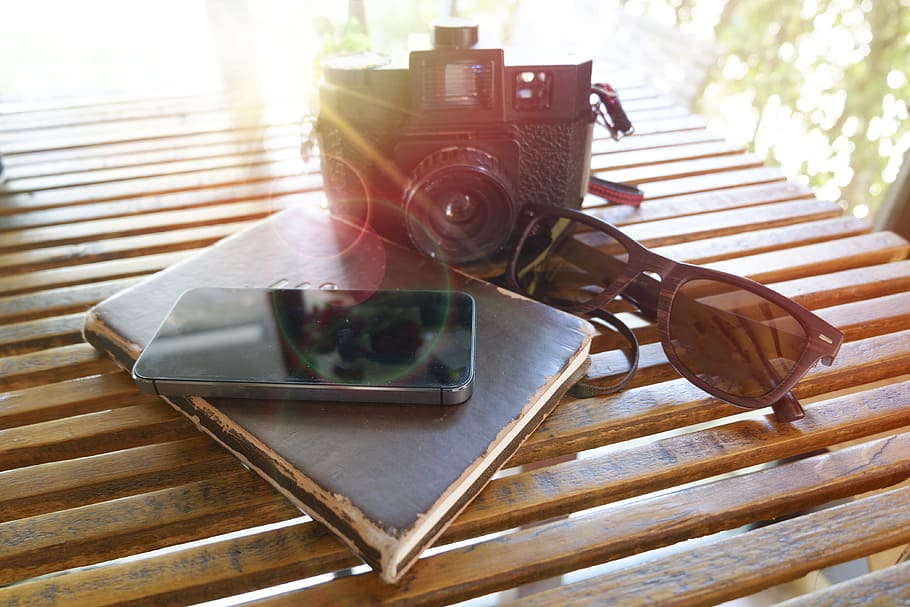 wood, landscape, sunglasses, camera, book, daylight, iphone, items HD wallpaper