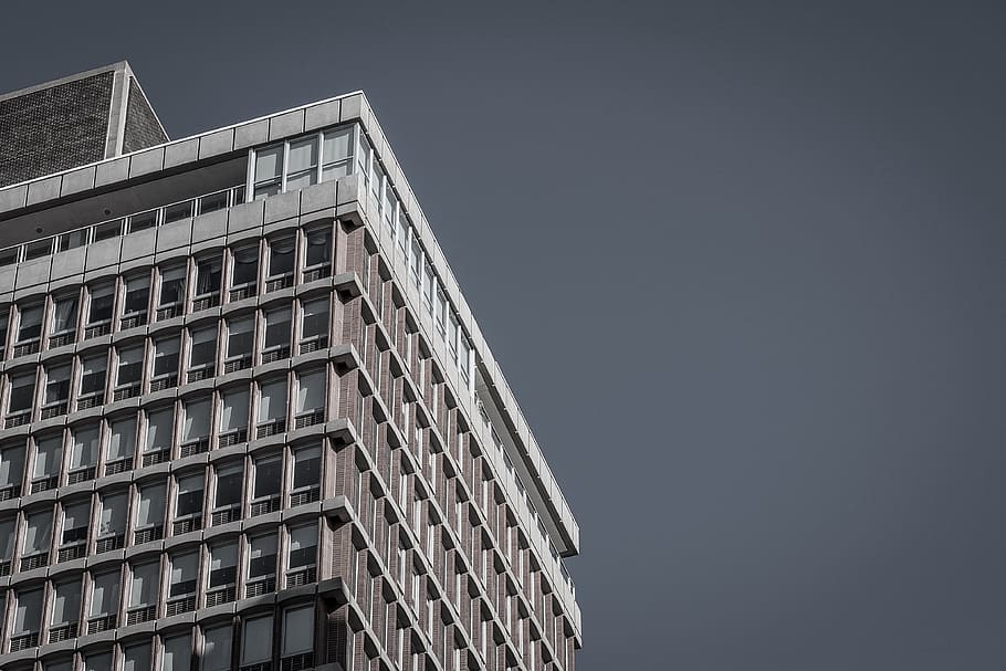 low-angle photography of high-rises building, brown and white high-rise building HD wallpaper