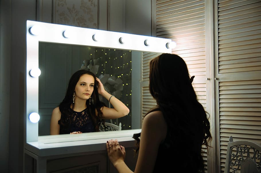 woman wearing black sleeveless top, woman looking on vanity mirror, HD wallpaper
