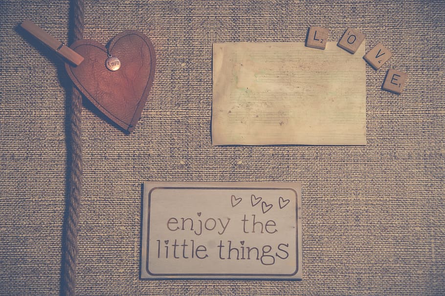 three assorted stickers on grey textile, background, wallpaper HD wallpaper