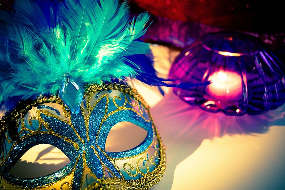 yellow and blue masquerade beside purple glass candle holder, HD wallpaper
