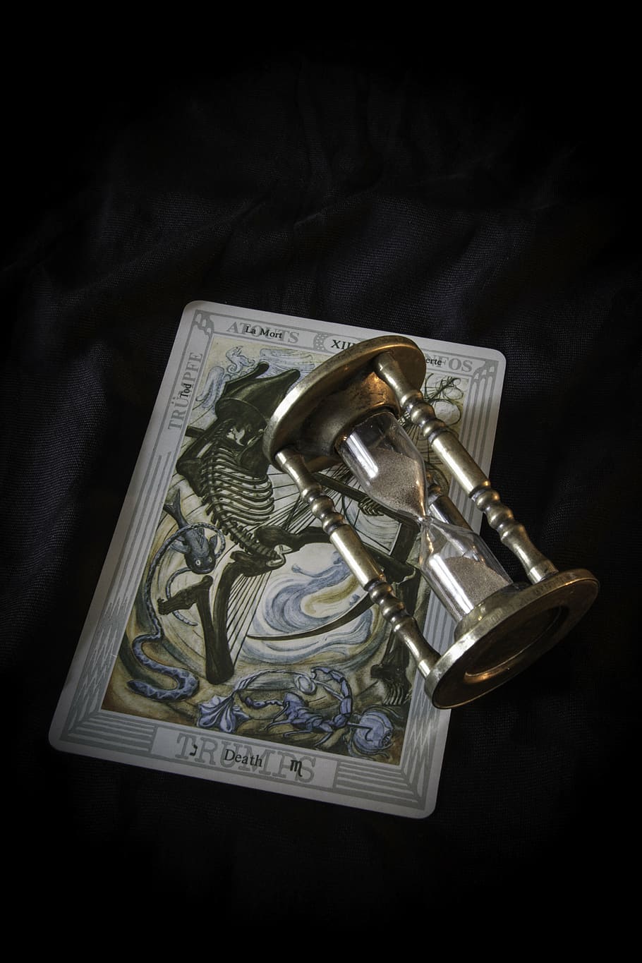 clear hourglass and white book, tarot, death, egg timer, magic