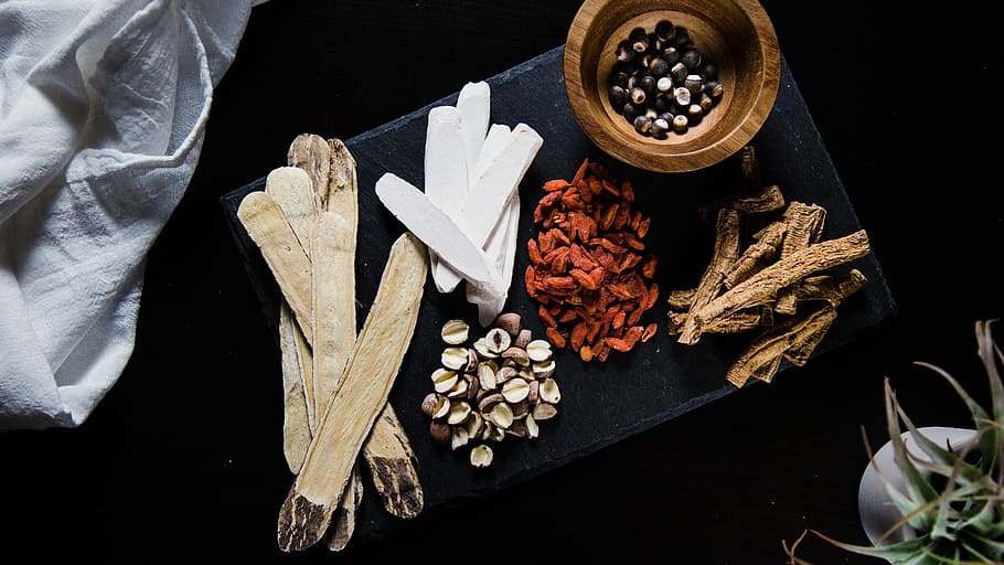 Raw Chinese herbal ingredients, several herbs and spices in flat lay photography