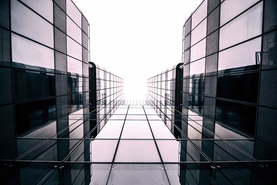 grayscale photography of glass pathway, worm's-eye view photography of black building HD wallpaper