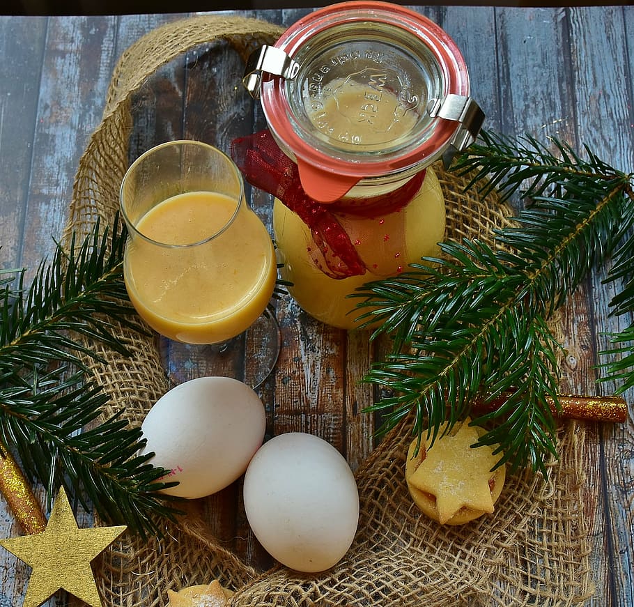 two white poultry eggs beside clear glass pitcher, advocaat HD wallpaper