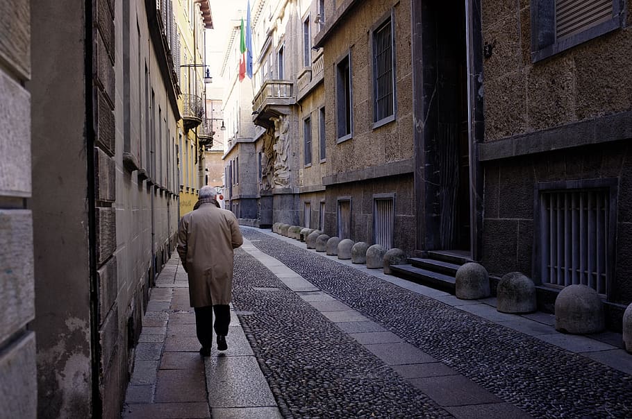 person walking near gray buildings, street, man, milan, italy, HD wallpaper