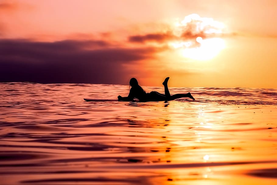 silhouette of person of surfboard on sea, surfer, ocean, sunset