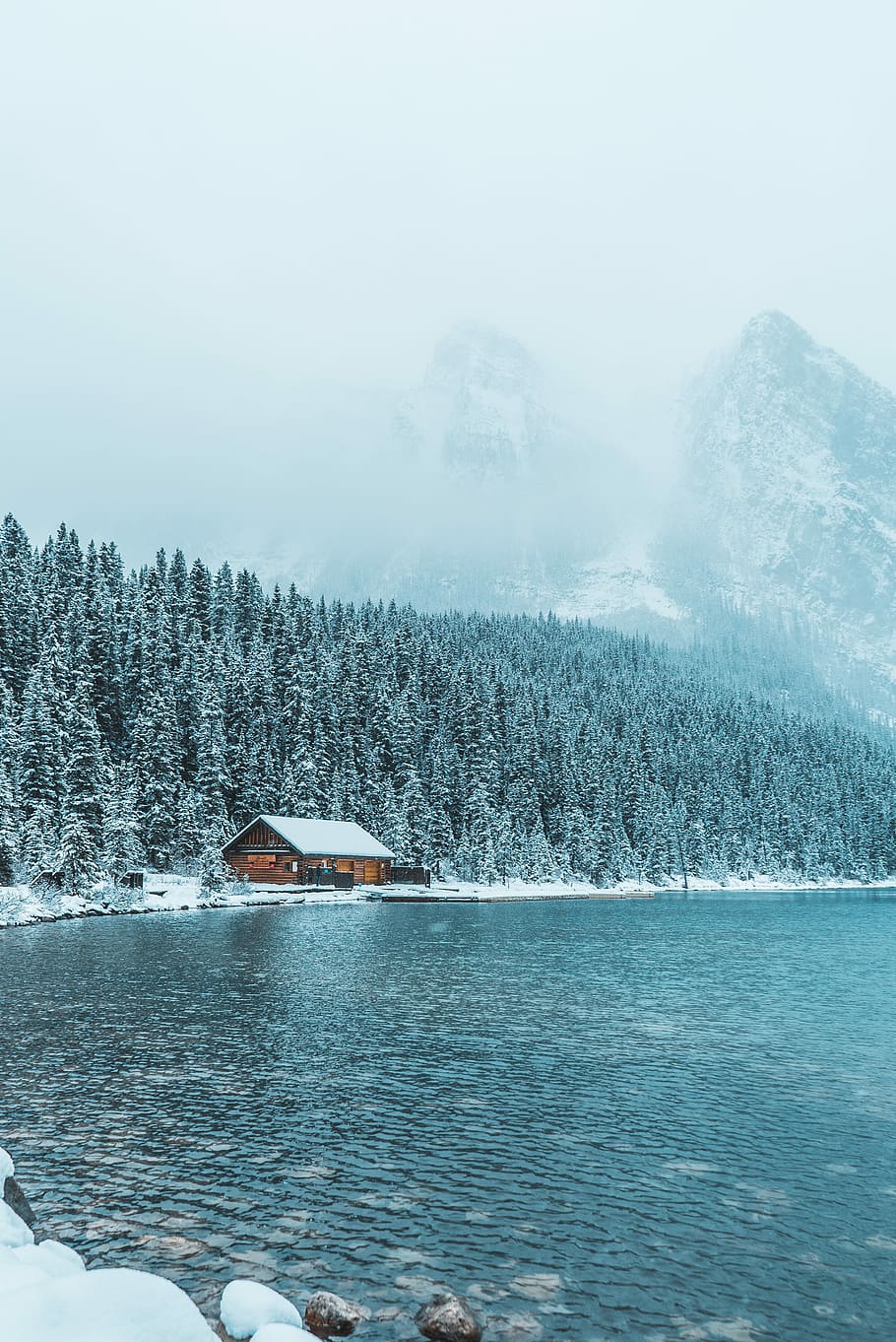 brown wooden house between trees and body of water during winter, brown house near body of water HD wallpaper