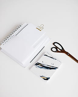 brown scissors near notebooks, white notebook, clip, spiral, paper HD wallpaper