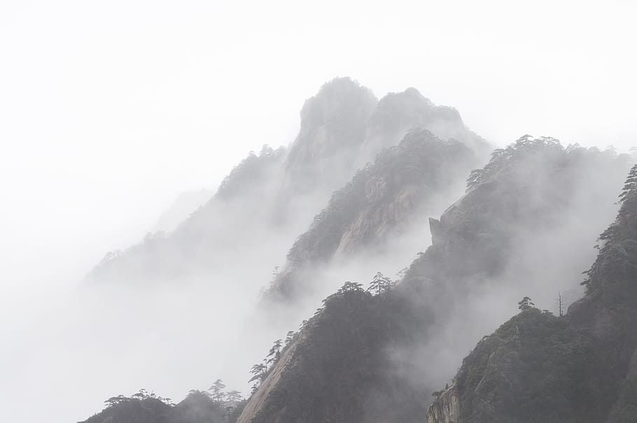 aerial photography of gray foggy mountains, huangshan, winter