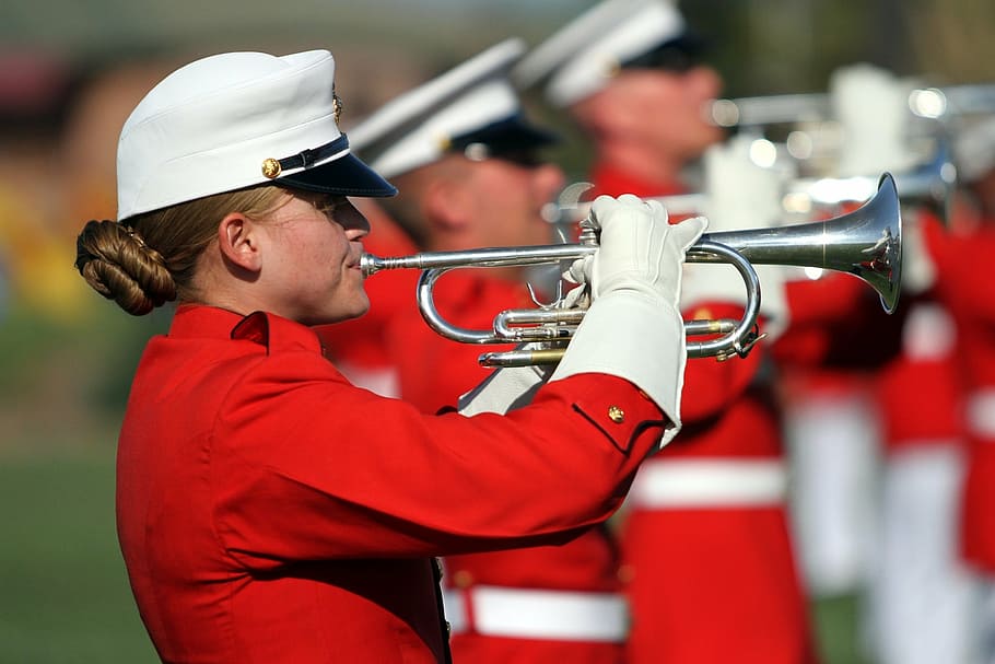 woman playing trumpet outdoor, trumpeters, marines, performance