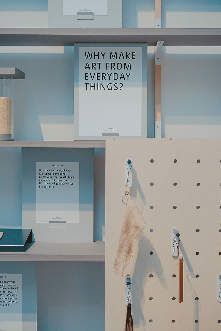 white wooden rack beside shelf, Why Make Art From Everyday Things book on shelf