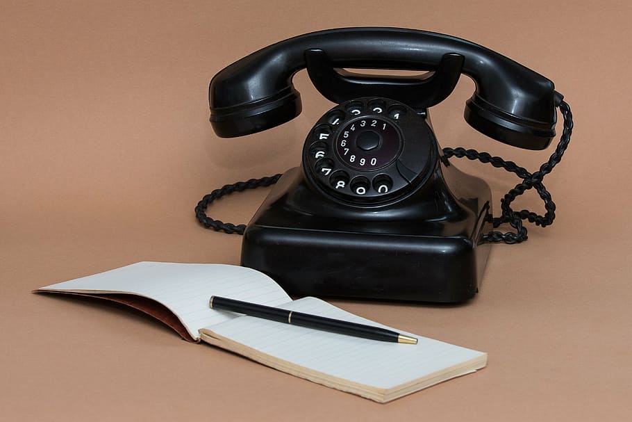 black rotary phone near notebook and pen, communication, message HD wallpaper