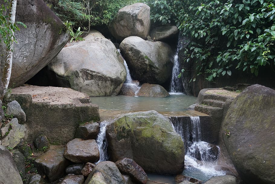 waterfalls surrounded by large rocks and plants, upstream, source HD wallpaper